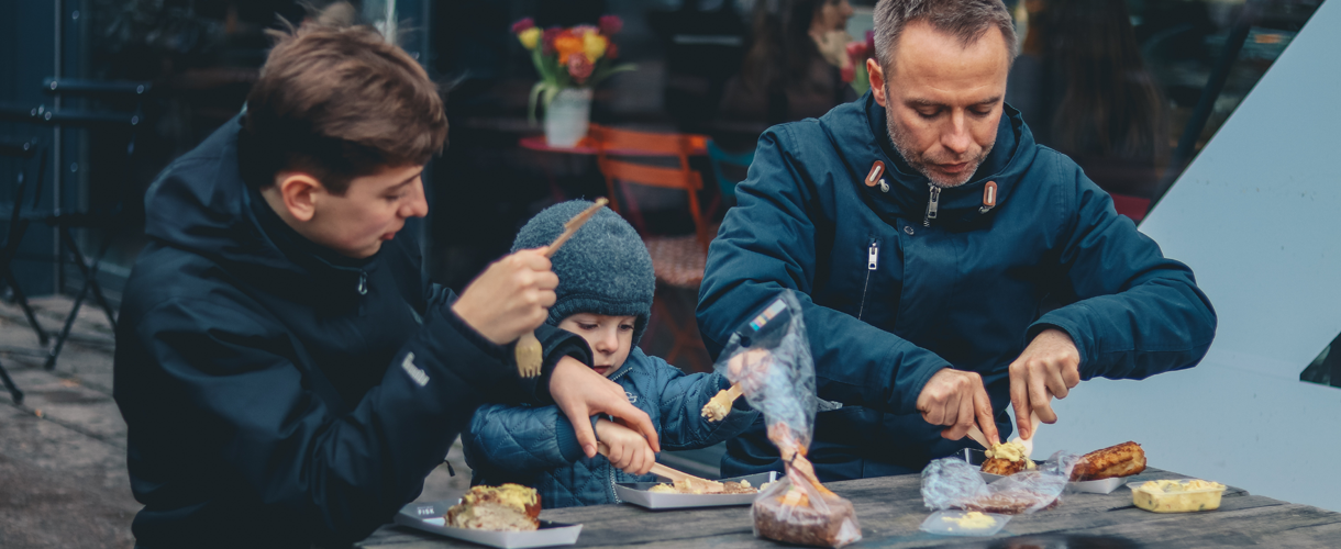 Family eating on a picnic bench