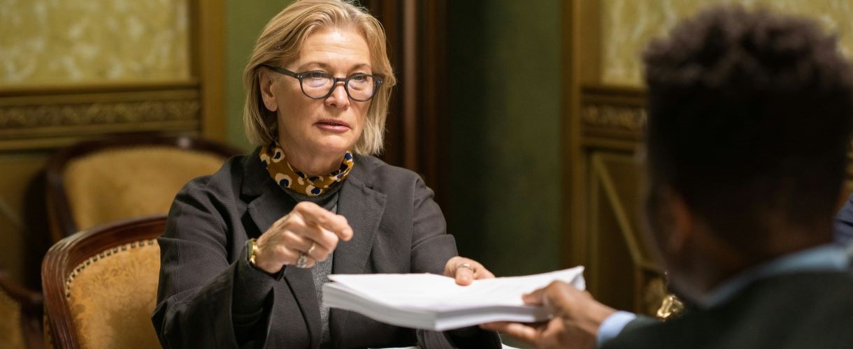 Business woman with stack of documents